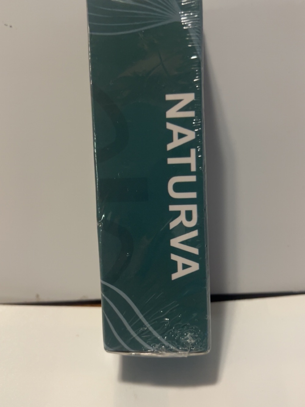 Naturva Skincare Product in Teal Packaging
